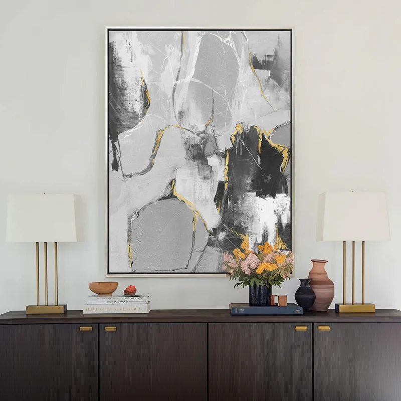 neutral abstract oil painting wall art decor in modern living room setting with lamps and flowers