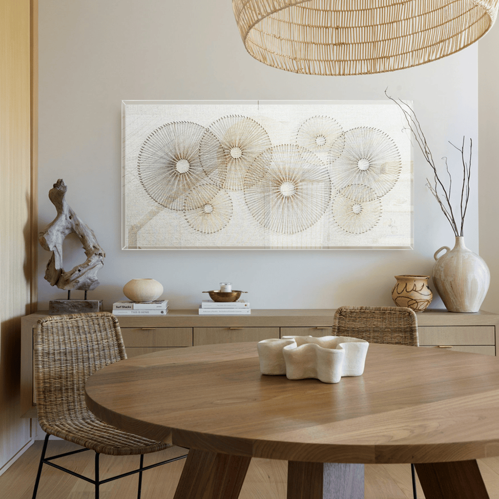Modern abstract wall art featuring layered circular forms created with nails and fine threads